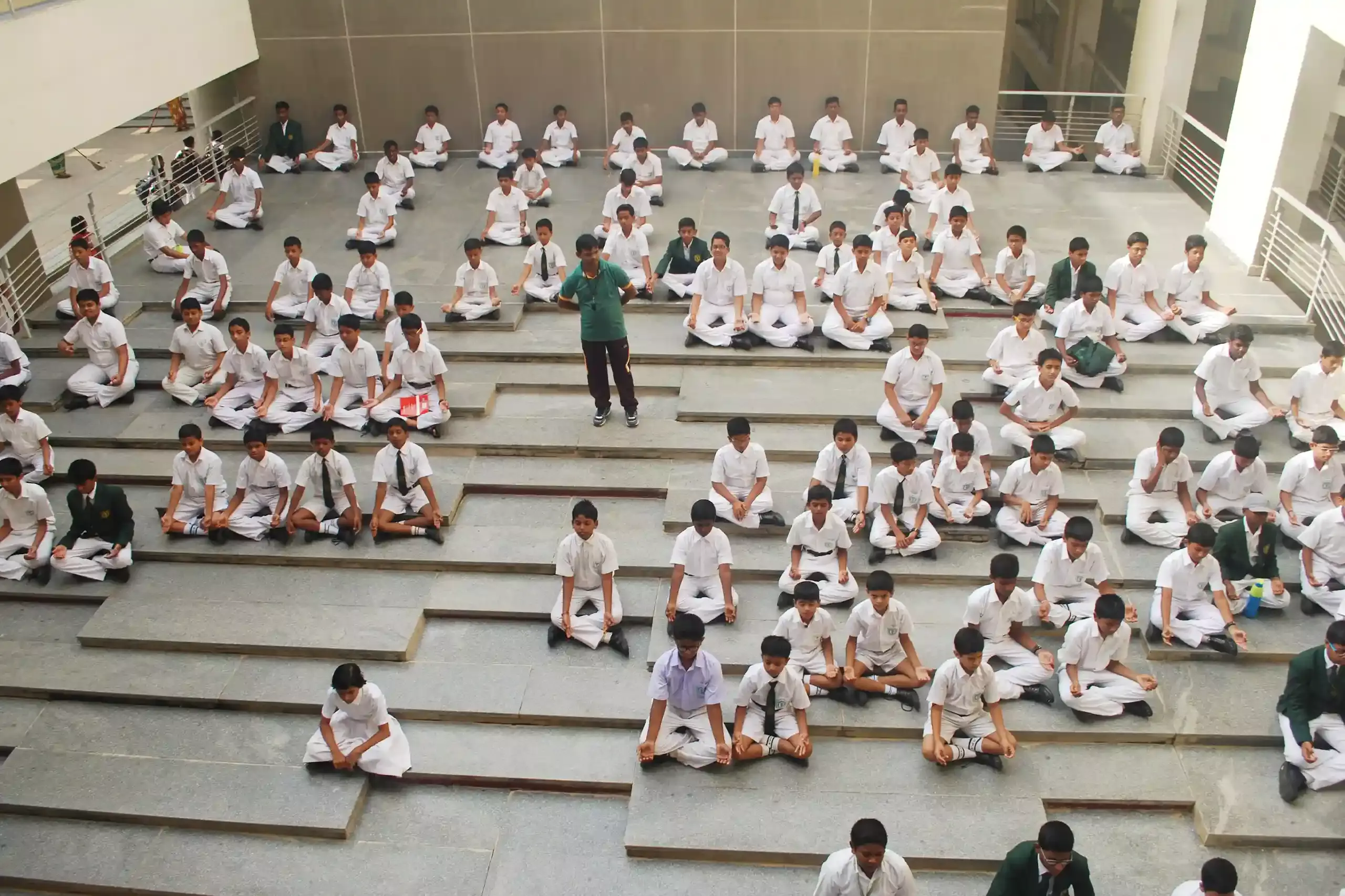 Students doing Yoga in school, to learn how to manage stress