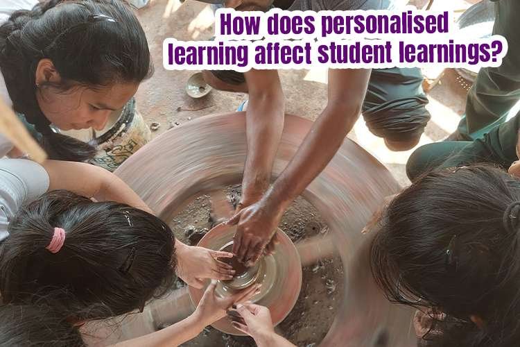 A group of people working on a pottery wheel for personalised learning.