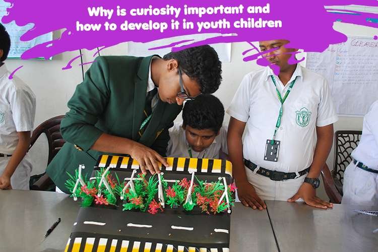 A group of people looking at a model of a road and showing curiosity