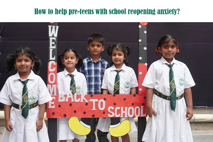 Group of pre-teen students in school uniform holding a “Back to School” frame, smiling on their first day, addressing school reopening anxiety.