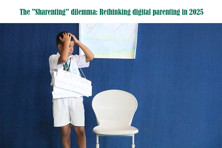 A young boy in a school uniform stands on stage with a sign around his neck, looking anxious with his hands on his head, showing the sharenting dilemma. A white chair is beside him.