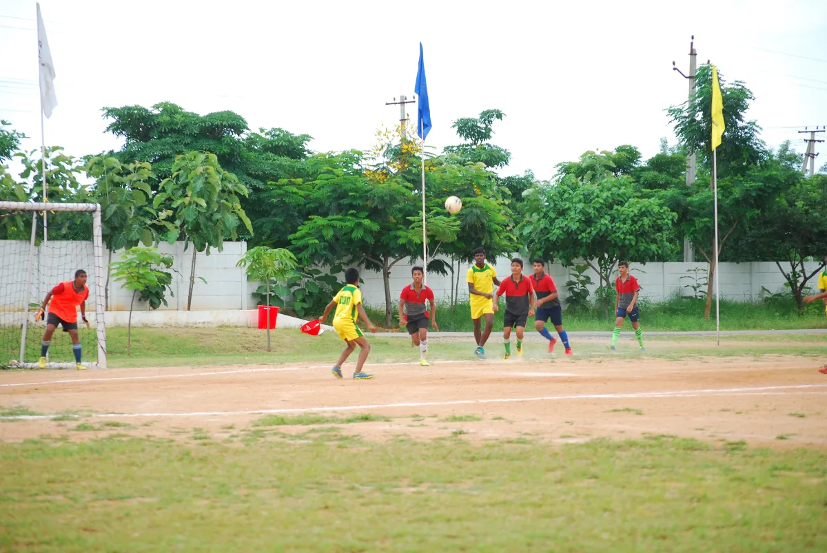 Students playing football in the ground at DPS, Warangal, Hanamkonda