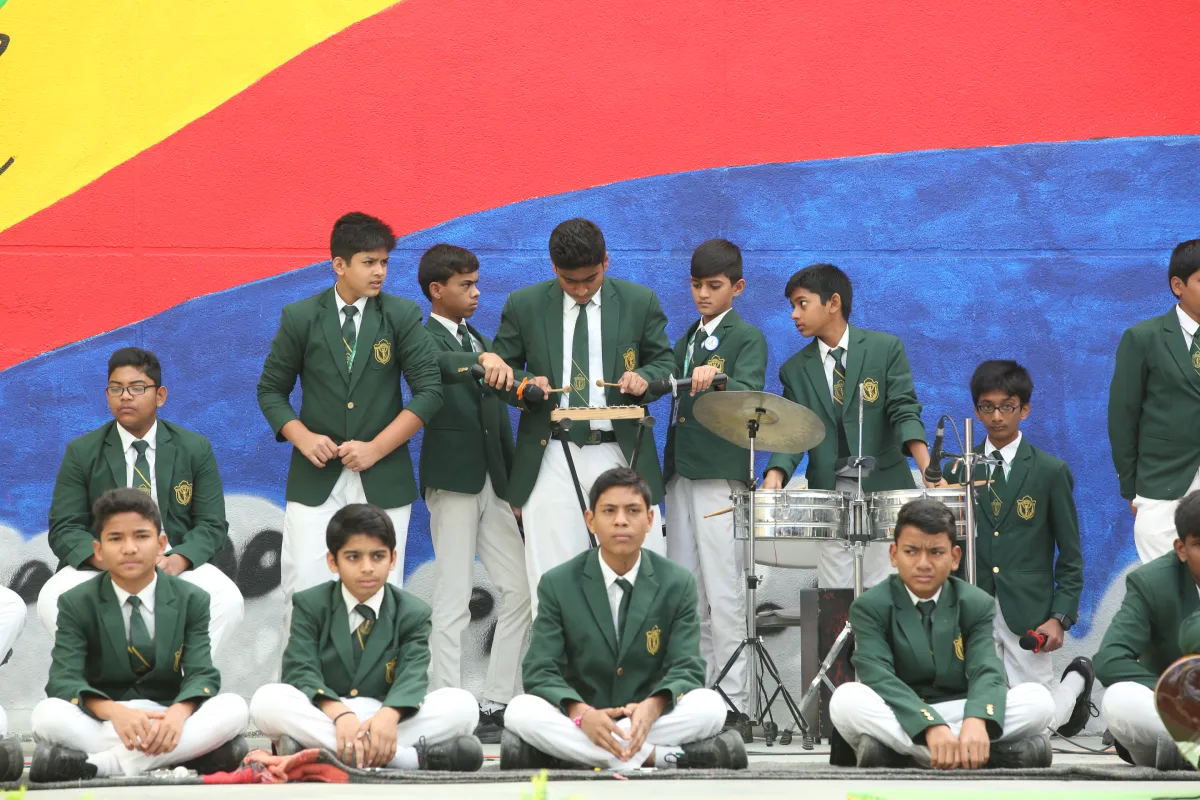 Students in DPS, Warangal playing drums and Octapad on the stage.
