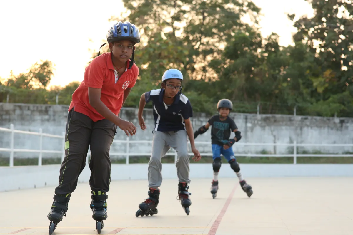 Students practicing skting in the skating court of DPS, Warangal wearing helmet and skating shoes