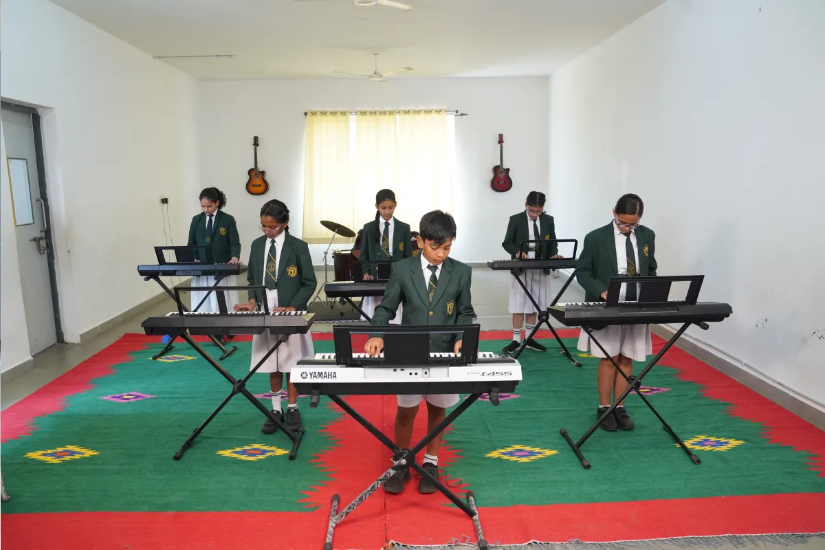 Students at DPS Warangal involve in various extracurricular activities like learning musical instruments.