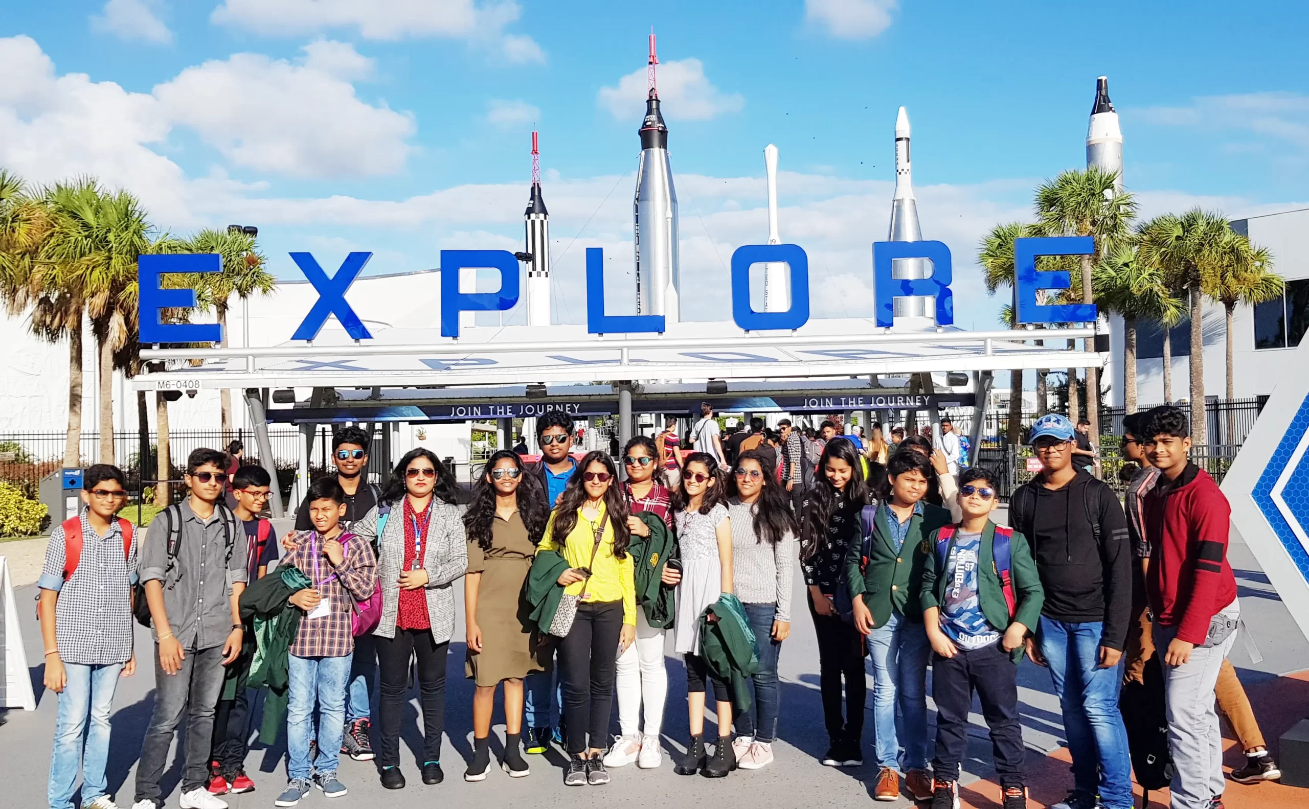 Students of DPS, Warangal standing outside space centre and getting clicked in group during visit to NASA.