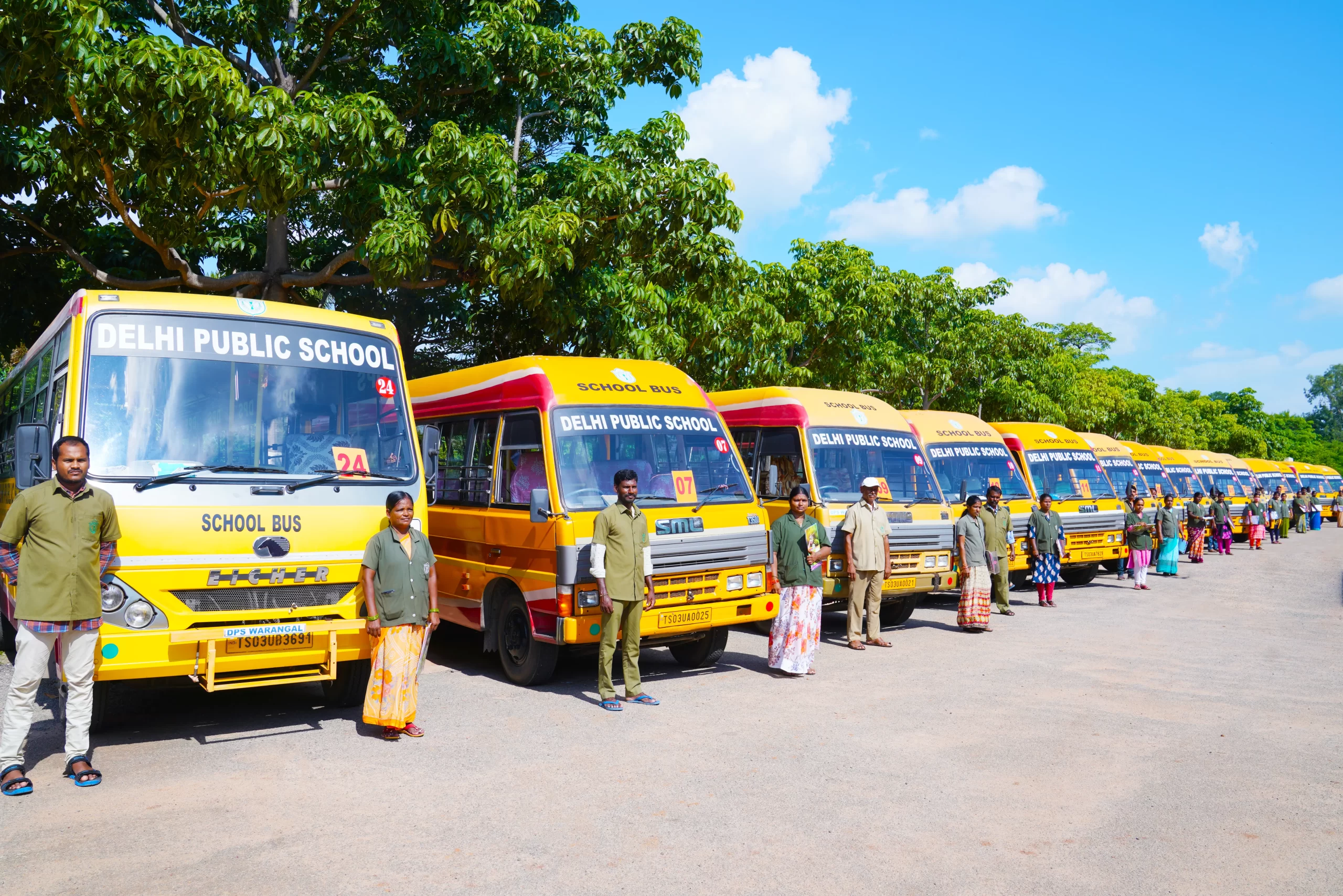 Dps Warangal school buses standing with their drivers and attendants.
