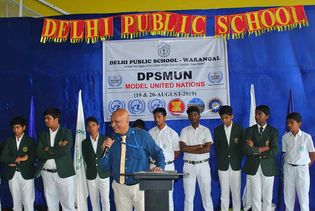 Teacher delivering speech during DPS Warangal United Nations Conference at DPS Warangal