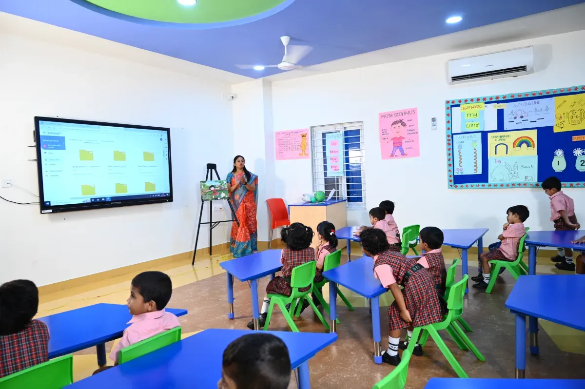 Teacher teaching students in an E-learning based classroom at DPS Hanamkonda, Warangal.