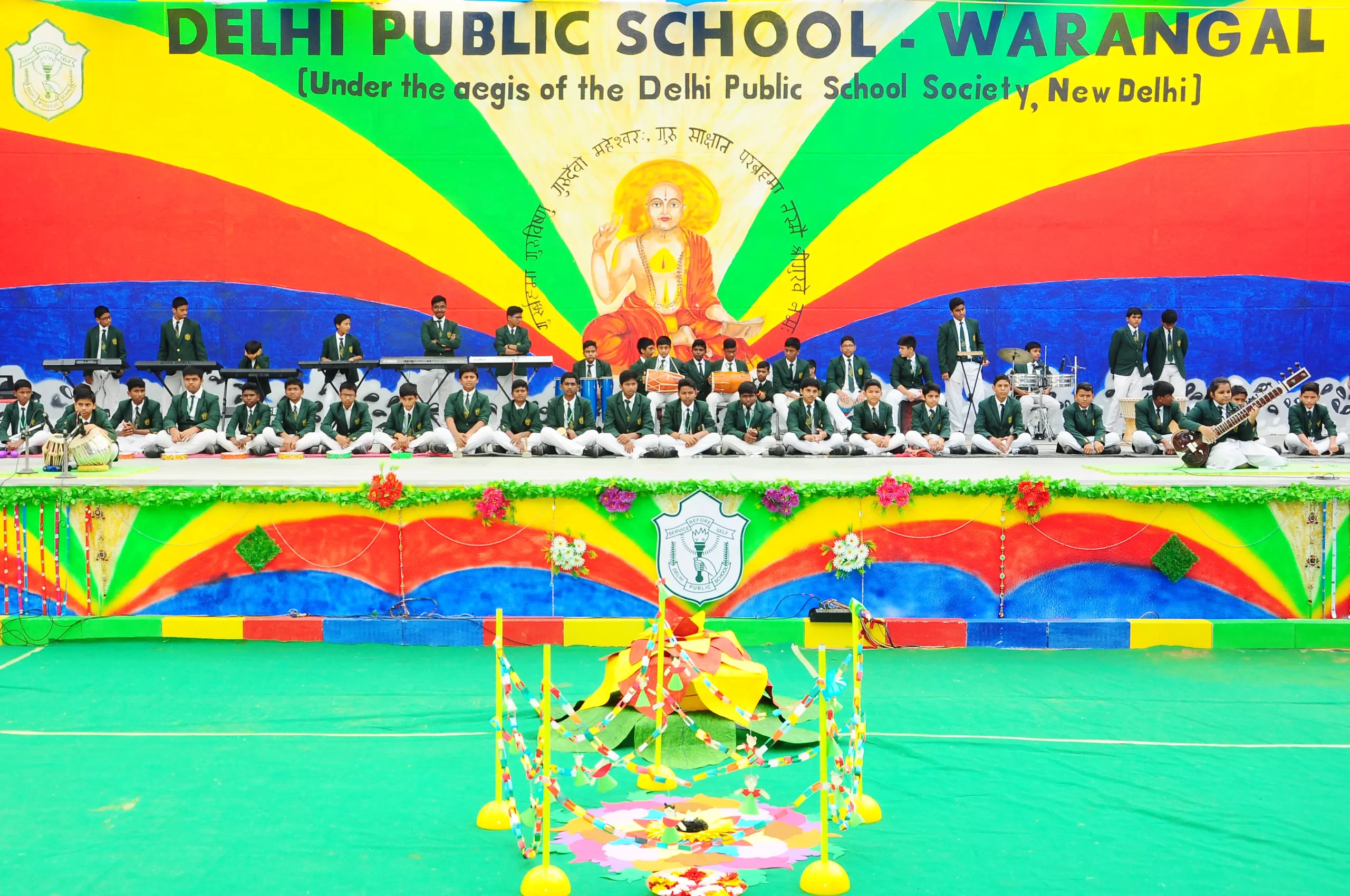 Students playing sitar, tabla, piano, and drums and performing on the occasion of Guru Purnima in DPS, Warangal