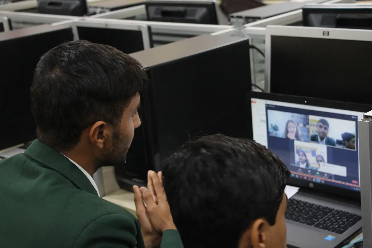 Students of DPS, Warangal attenging video meeting in computer laboratory in a laptop.