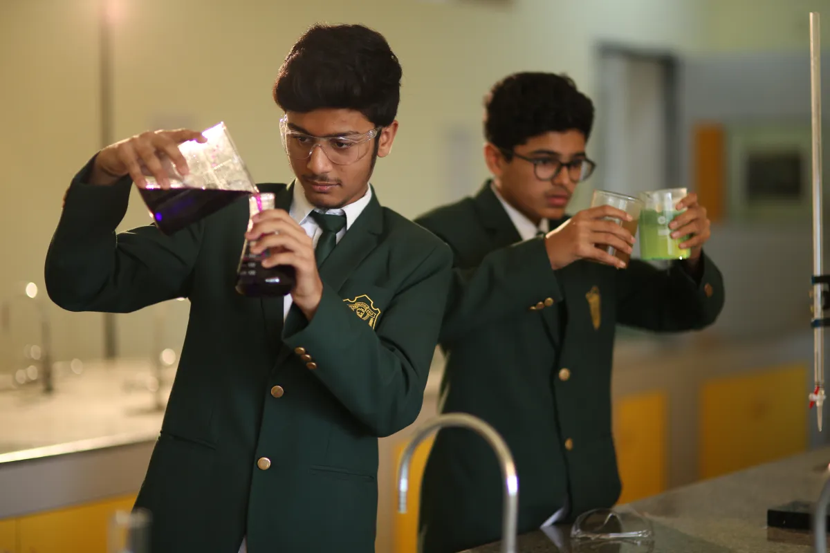 Students carrying out chemical experiments in laboratory devoted for chemistry at DPS, Warangal