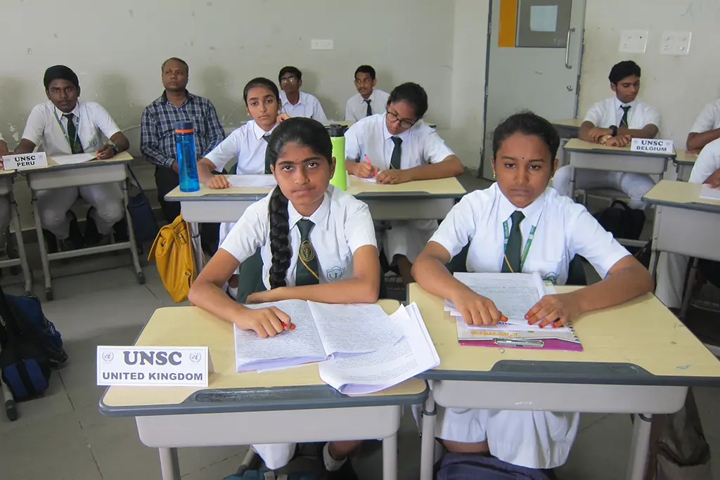 Students sitting in the class completing their assessment in DPS Warangal