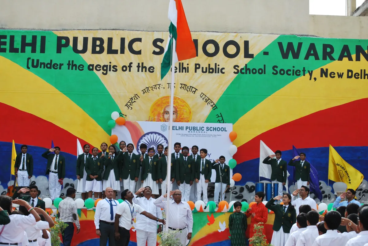 Students singing National Anthem and flag hoisting ceremony taking place at DPS Warangal.