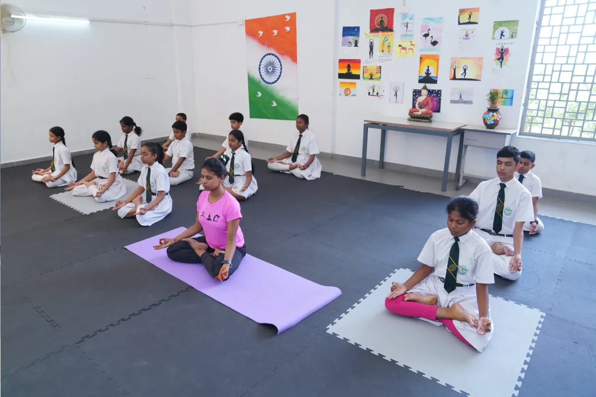 Students at DPS Warangal practicing yoga and exercises that promote health and wellbeing