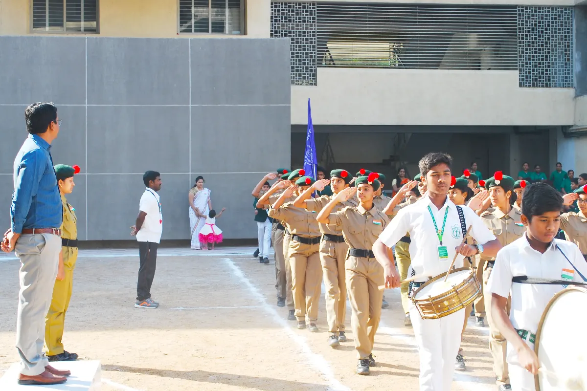 Students at DPS Warangal performing march past and parade under the guidance of teachers