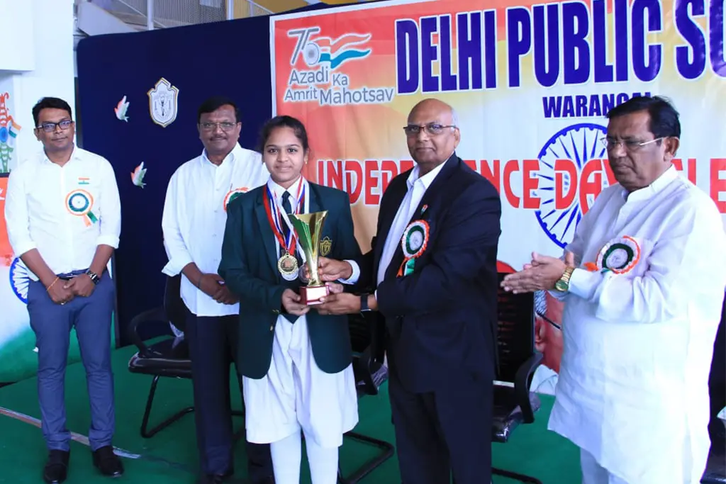 Student of Delhi Public School, Hanamkonda, Warangal receiving trophy from chief guest during Independence day celebration.