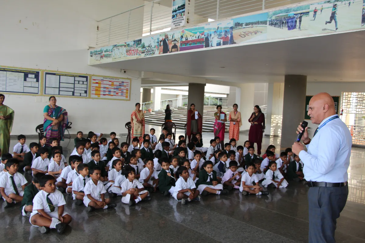 Students attending the session while sitting in the activity hall along with their teachers at DPS Warangal.