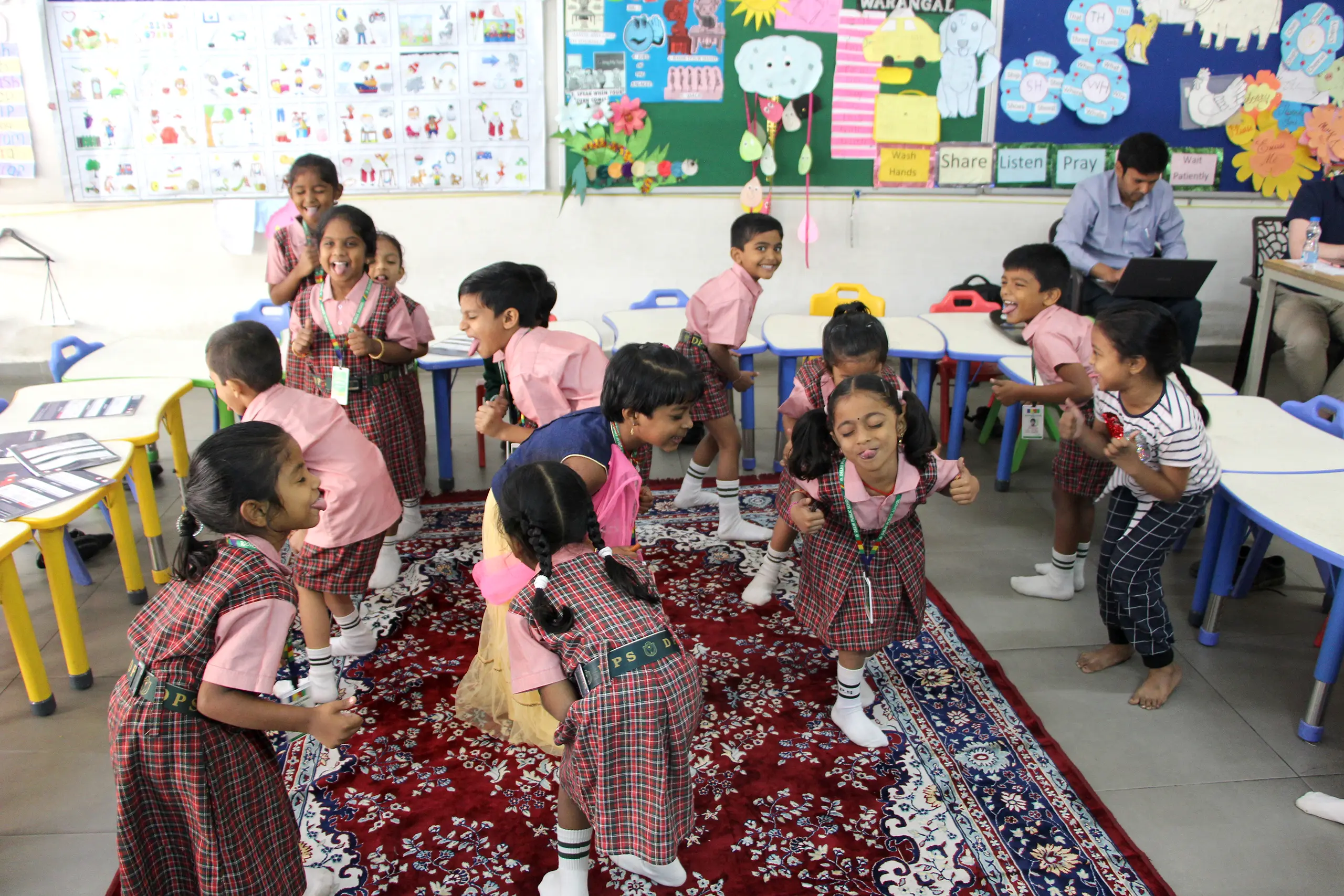 Childrens playing and having fun in the classroom.