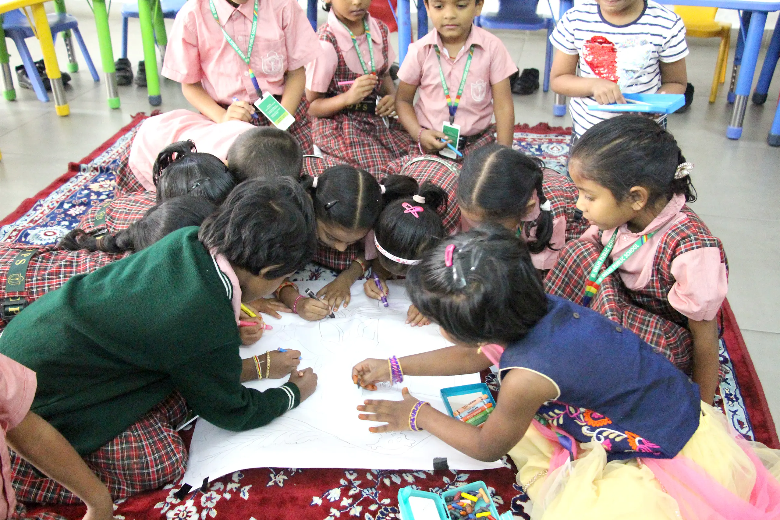 Students participating in colouring activity in group at DPS Warangal.