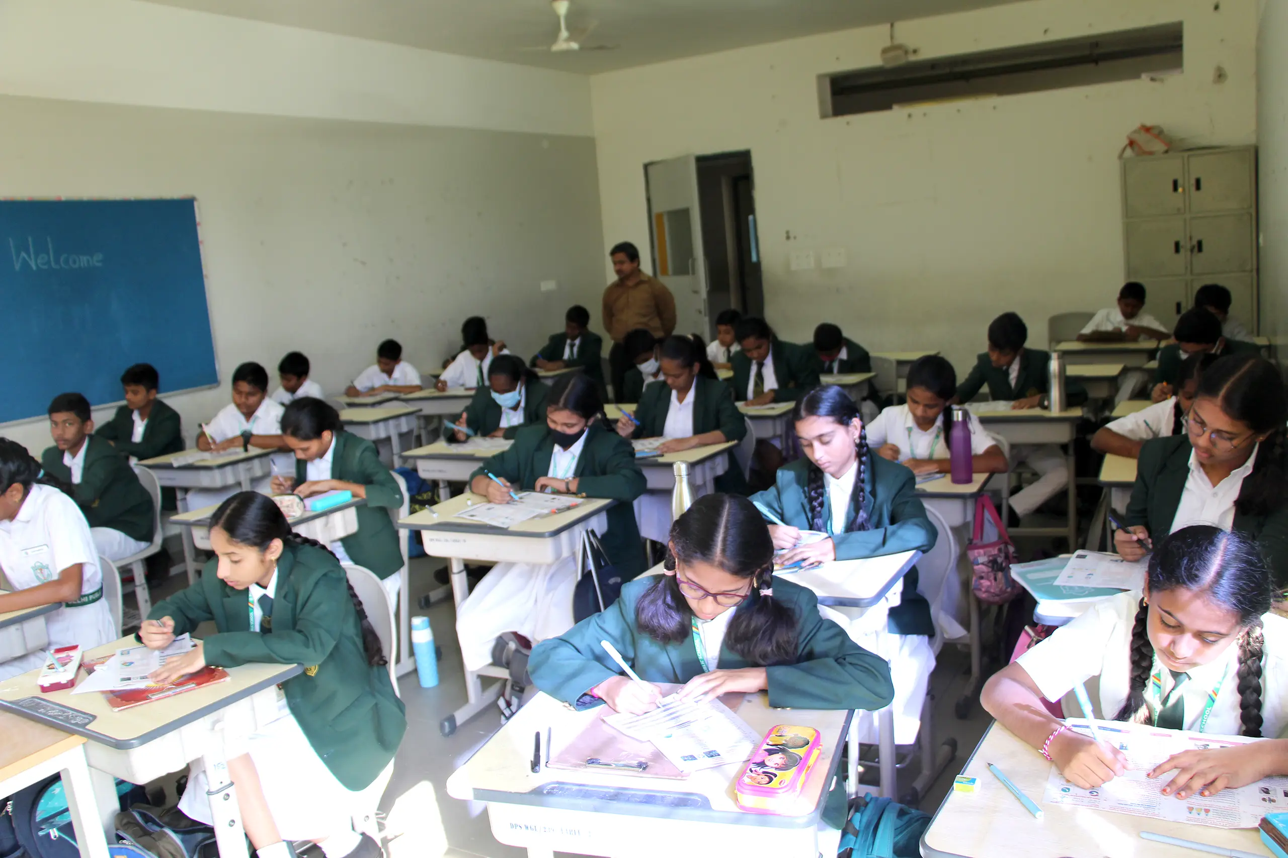 Students giving Chekumuki science test under the supervision of teachers at DPS Warangal.