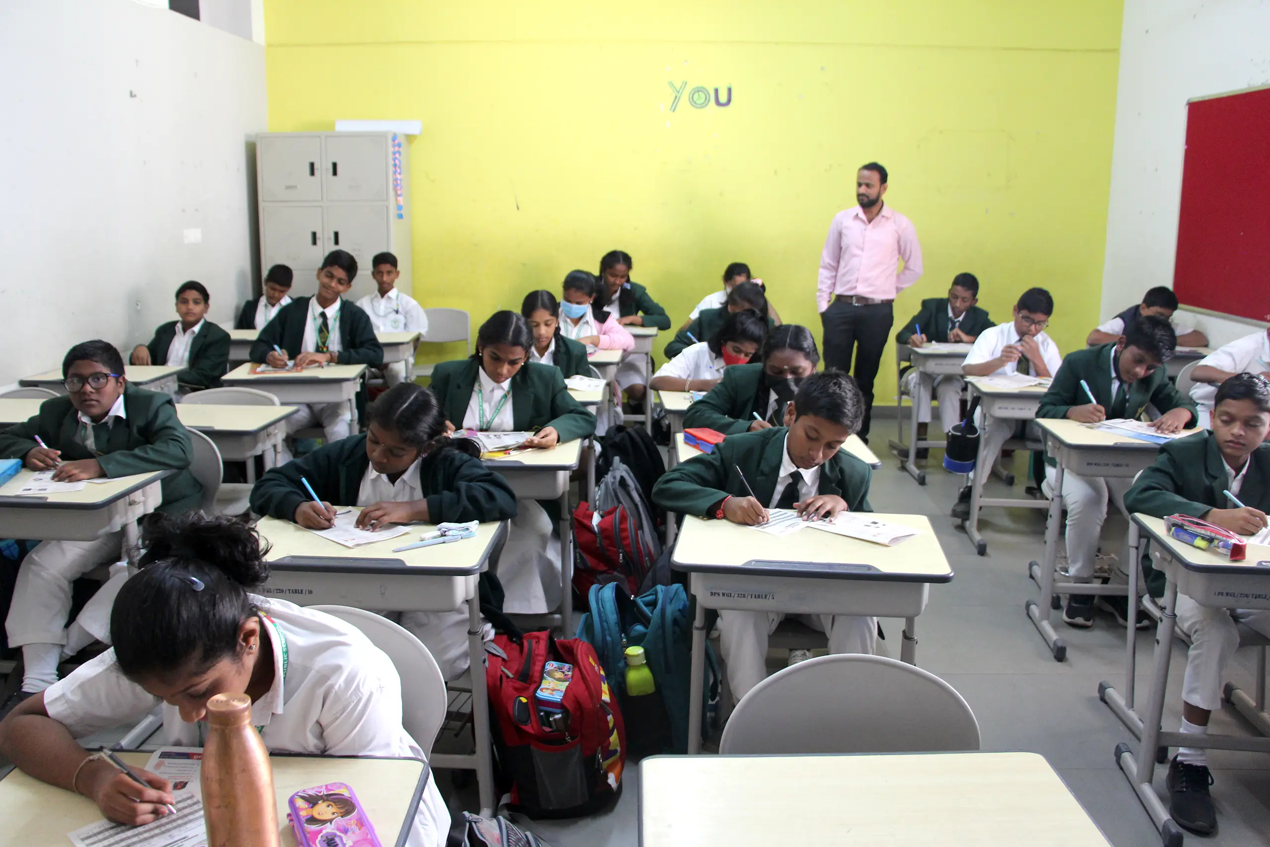 Students giving Chekumuki science test under the supervision of teachers at DPS Warangal.