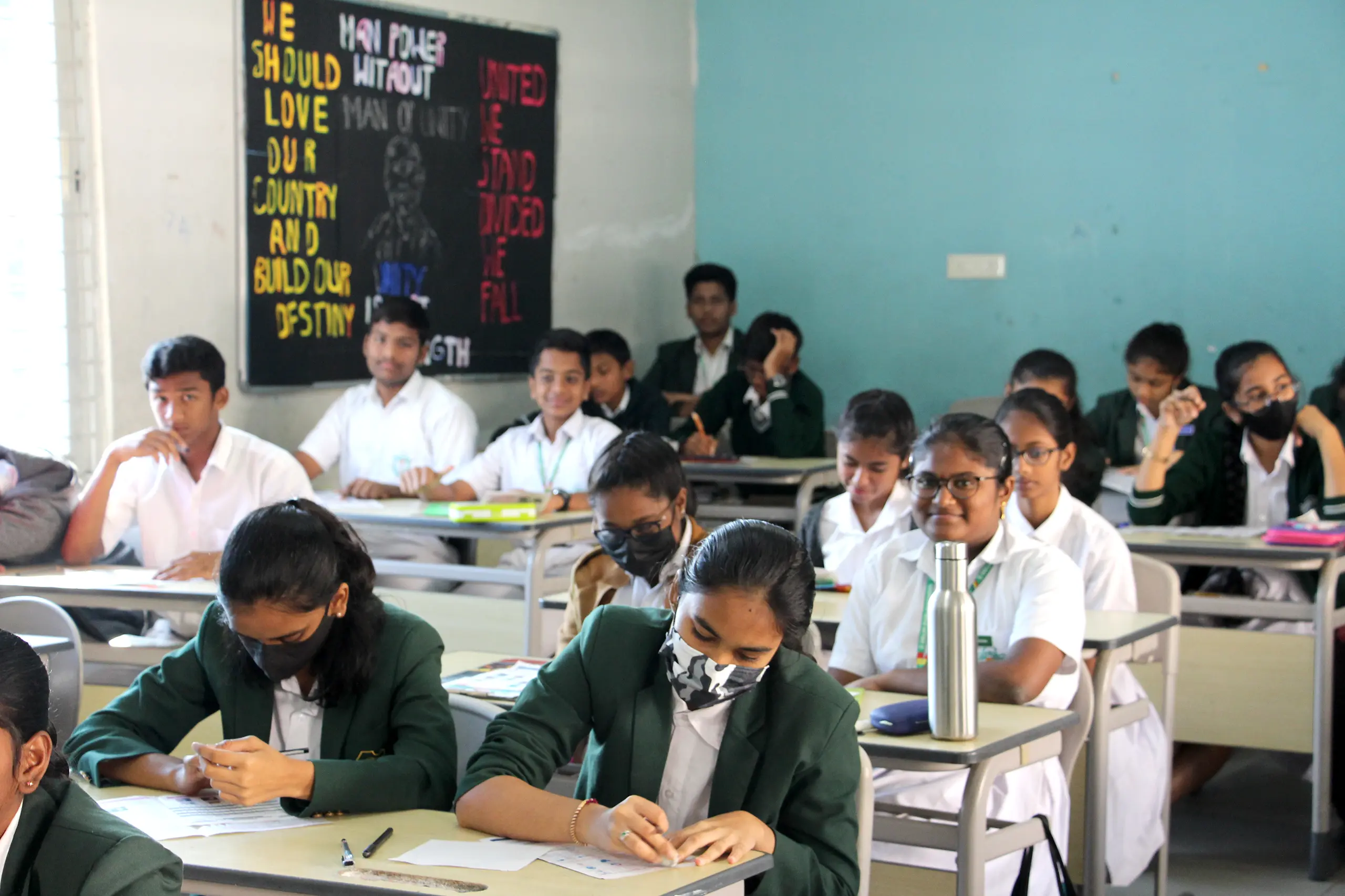 Students giving Chekumuki science test under the supervision of teachers at DPS Warangal.