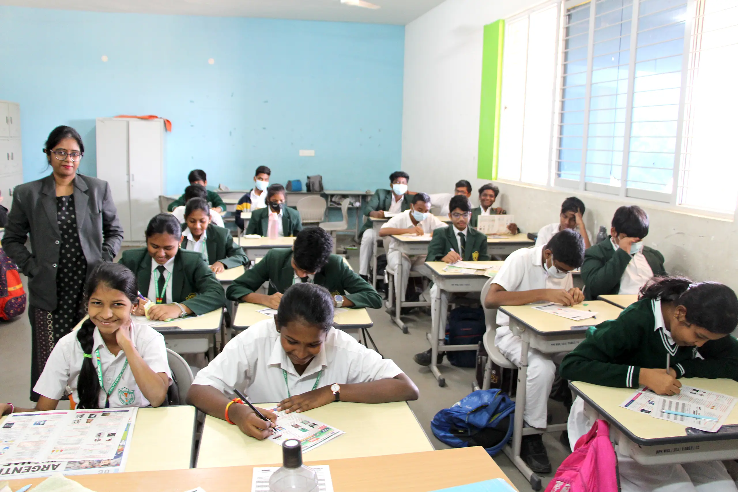 Students giving Chekumuki science test under the supervision of teachers at DPS Warangal.