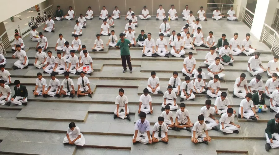 Students doing Yoga in school, to learn how to manage stress