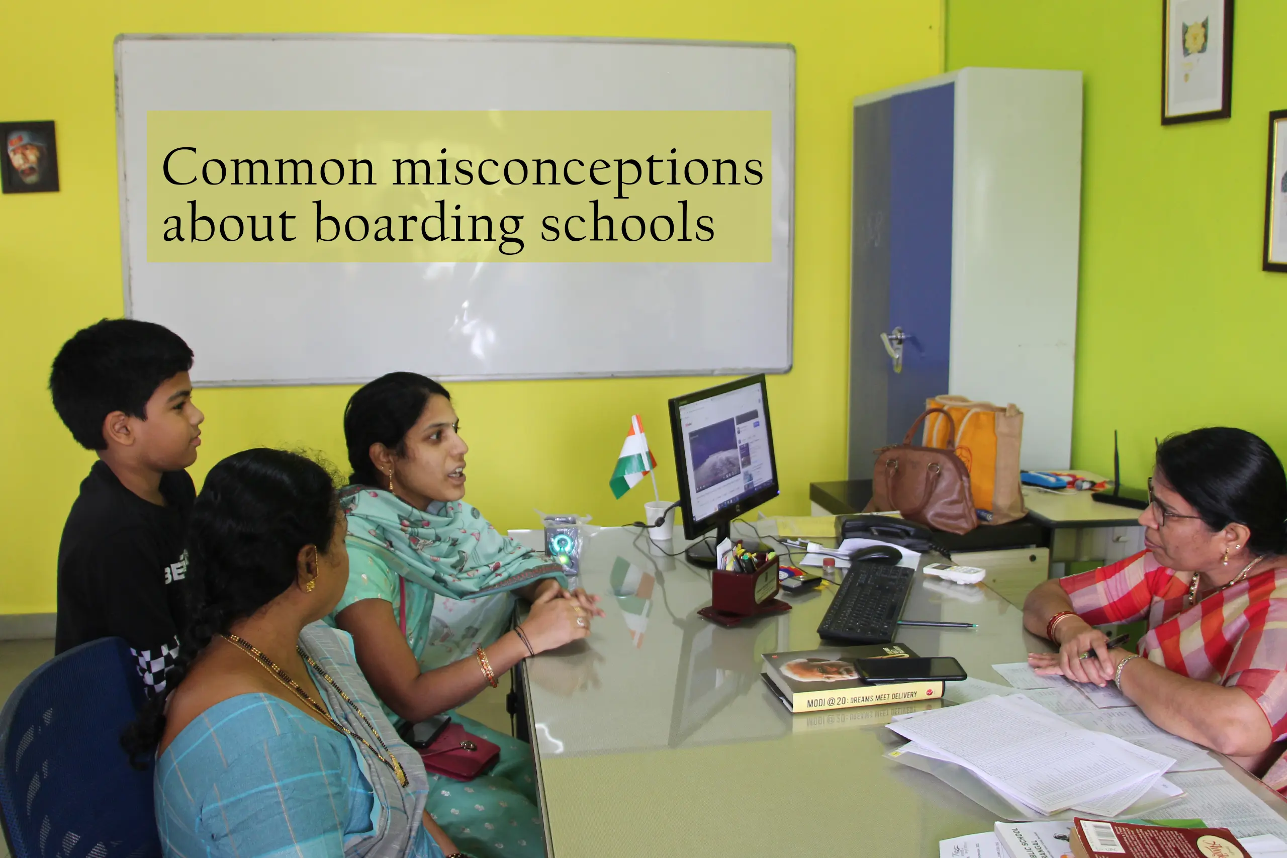 Parents having discussion with teacher at DPS Warangal regarding myths associated with boarding schools.