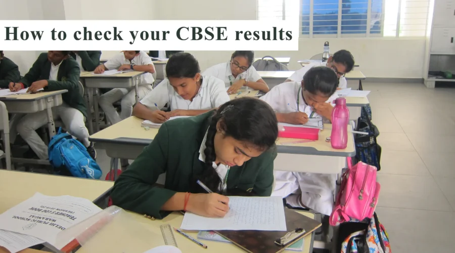 The image captures the focused atmosphere of students writing exams, accompanied by the text 'How to check your CBSE results' at the top.