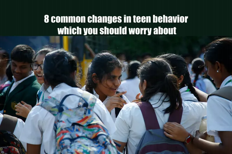 A group of students wearing uniforms talking to each other, a text “8 common changes in teen behaviours to worry about” at the top of the image.