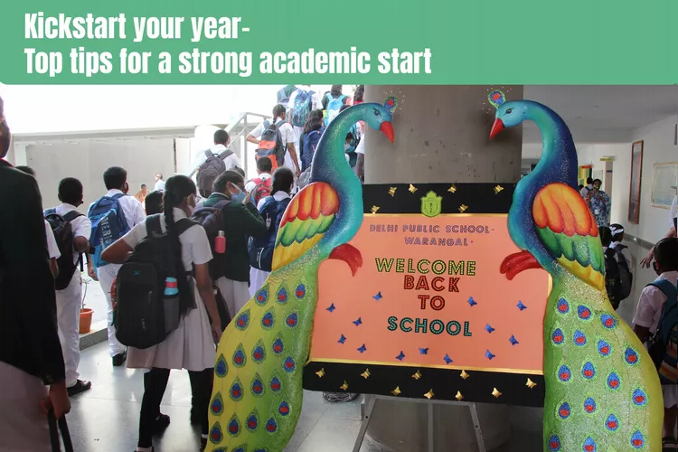 a bustling school environment, as groups of students with backpacks and hats traverse the hallways and stairs. The scene is dominated by a welcome back to school sign featuring peacocks, which is prominently displayed on a wall in the background. The text ‘Kickstart your year - Top tips for a strong academic start’ is at the top of the image.