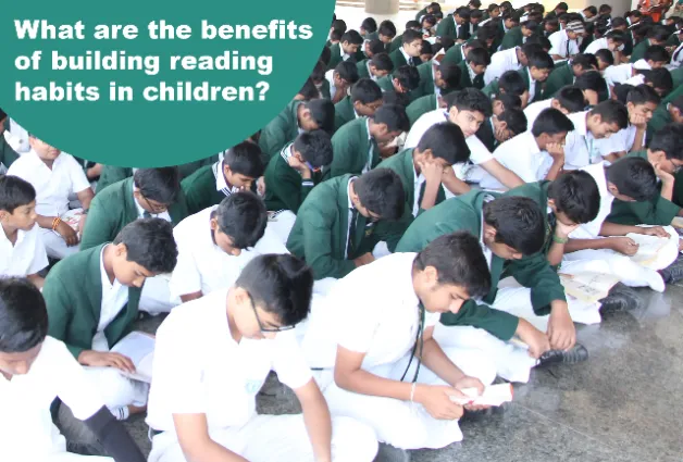 Students sitting and reading books in the school, indicating the good reading habits