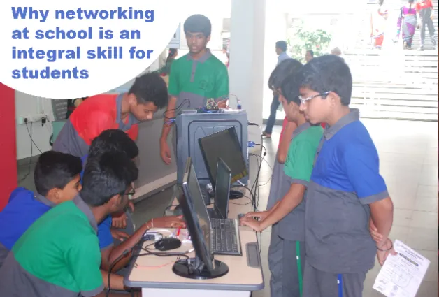 Students standing and helping each other in work.