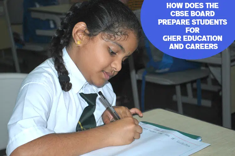 DPS school young girl sitting at a desk writing on a piece of paper.