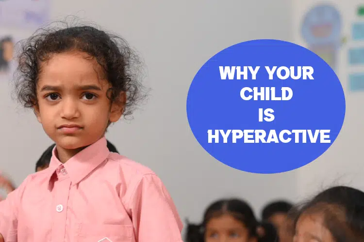 a young girl standing in front of a group of children.