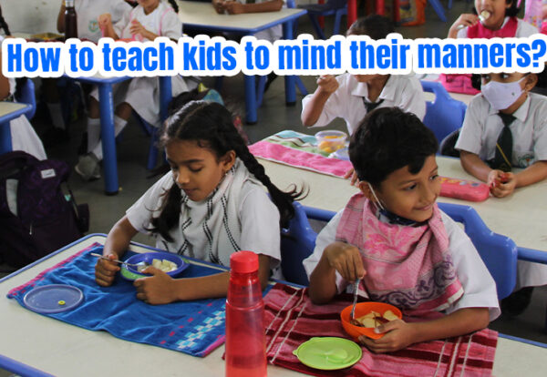 A group of children eating in a classroom and learning manners