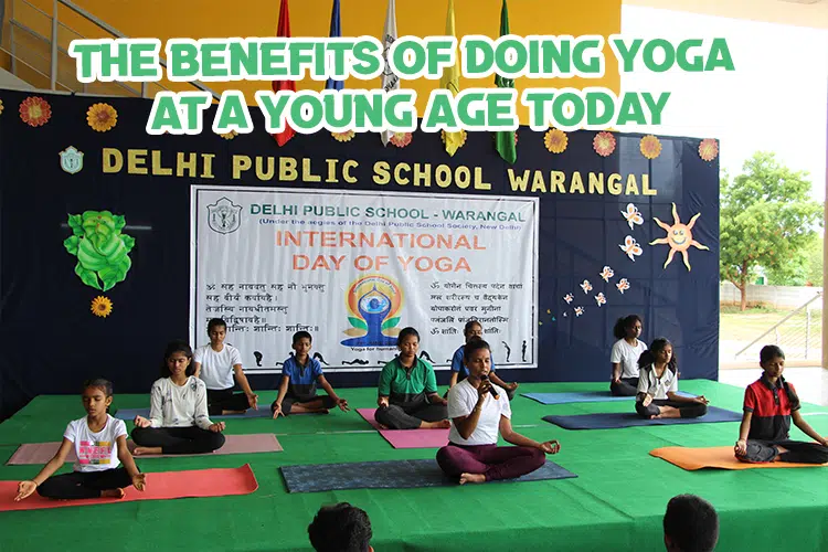 A group of people sitting on mats doing yoga