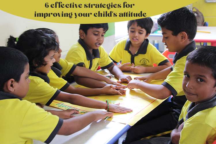 A group of young boys in yellow shirts sitting at a table. playing board games to improve the child's attitude