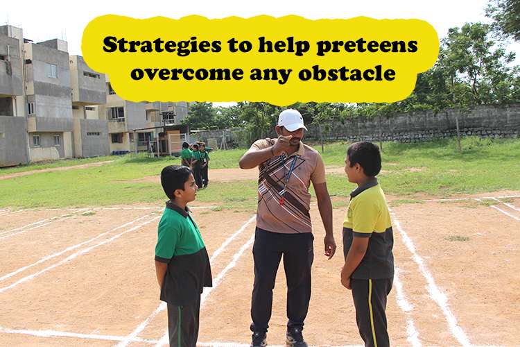 A coach stands with two children, offering guidance to overcome obstacle.