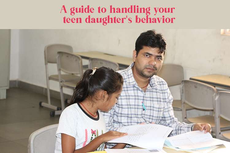 A person, likely a parent, sits alongside a teenager, both engaged in studying together, showcasing the positive teen daughter's behavior.