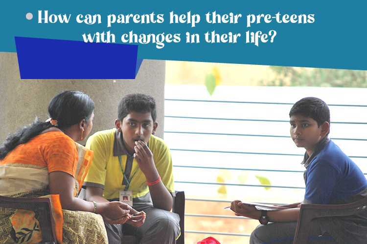 Parent assisting child in navigating life changes while seated together in chairs