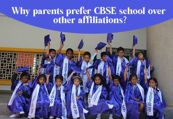 A group of DPS CBSE school students tossing their graduation caps.
