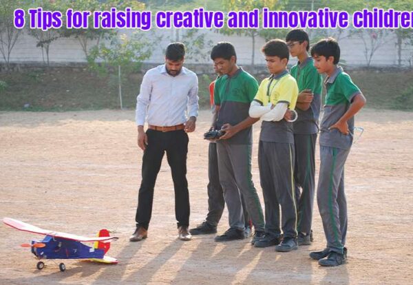 Group of young men standing near a creative toy airplane, appearing fascinated and engaged.