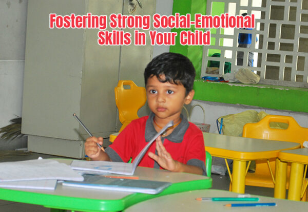a child sitting at a desk with pens and pencils learning social and emotional skills
