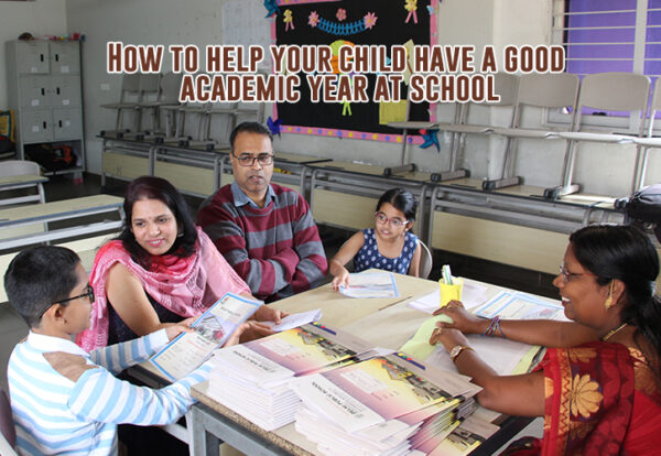 A group of DPS parents engaged in academic discussion while seated at a table.