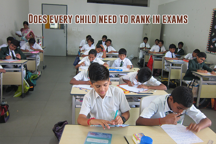 A group of students in a classroom giving exams