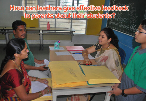 A teacher is giving feedback on student performance to the parents at a table