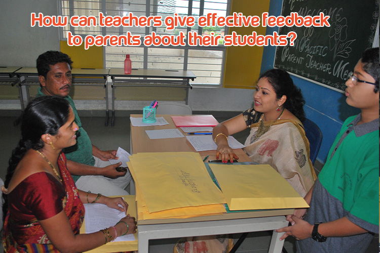 A teacher is giving feedback on student performance to the parents at a table